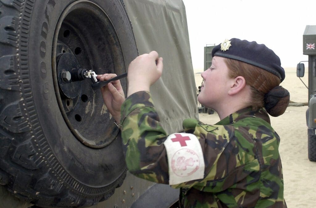woman soldier repairing vehicle - ex military bringing value to field engineering