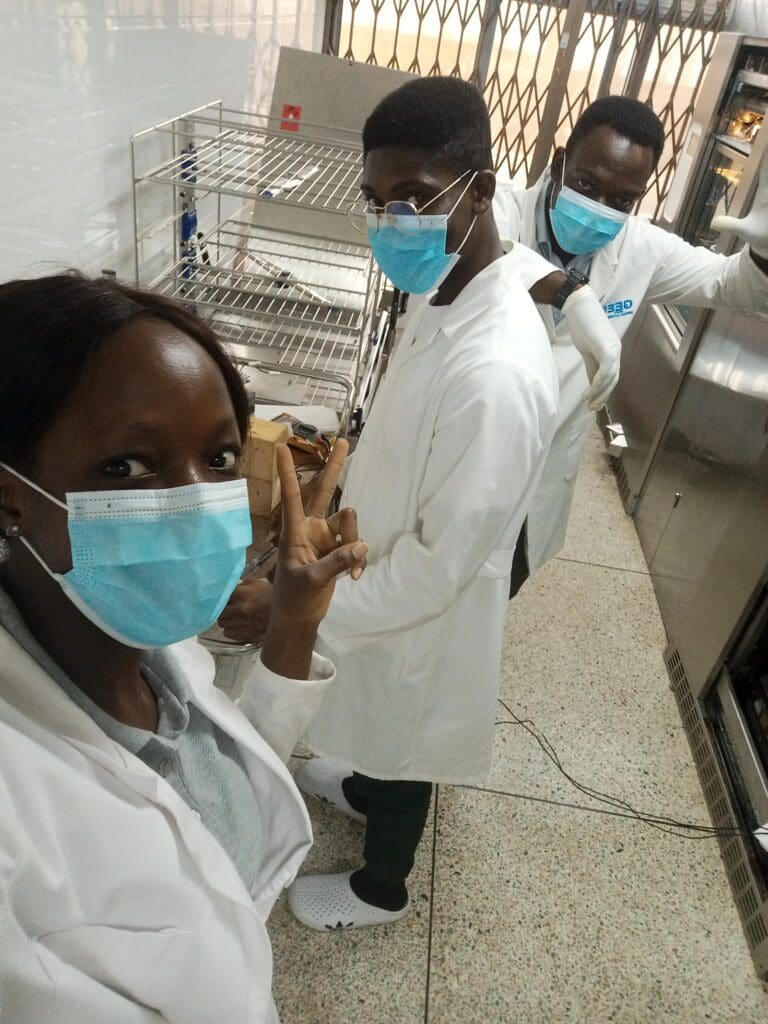 Alex Nii Nortey Dowuona with colleagues working as biomeds