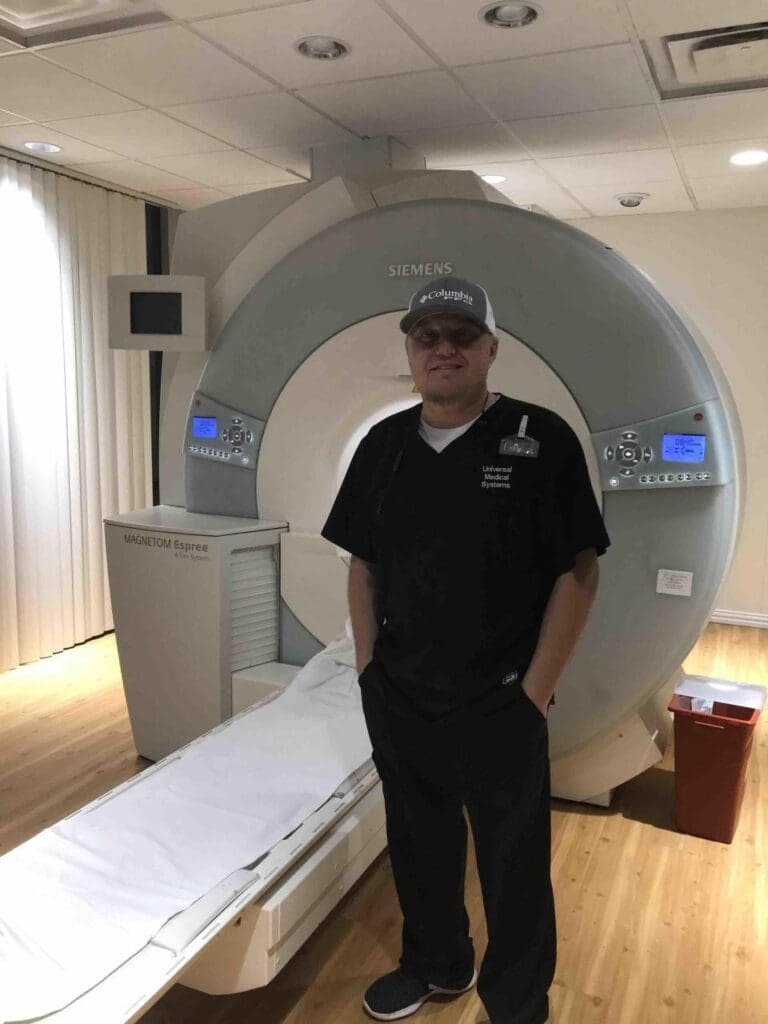 David Barron Radiology Service Engineer by scanner