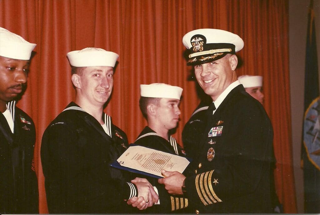 Jonathan Haymans in uniform receiving award