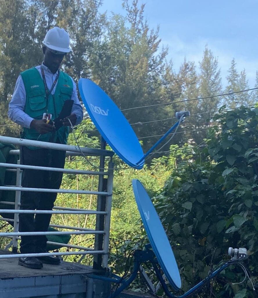 Chidiogo Okoli Field Engineer Broadcast Media with satellite dish on roof