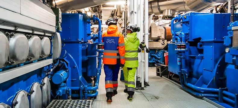 engineers onboard ship in ppe for Marine Field Service Manager