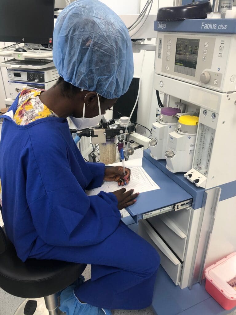 Yaa Amoakoa Frempong Biomedical Engineer in Ghana in lab writing report with Fabius equipment