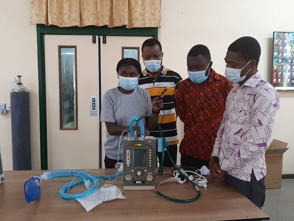 Yaa Amoakoa Frempong with colleagues demonstrating equipment