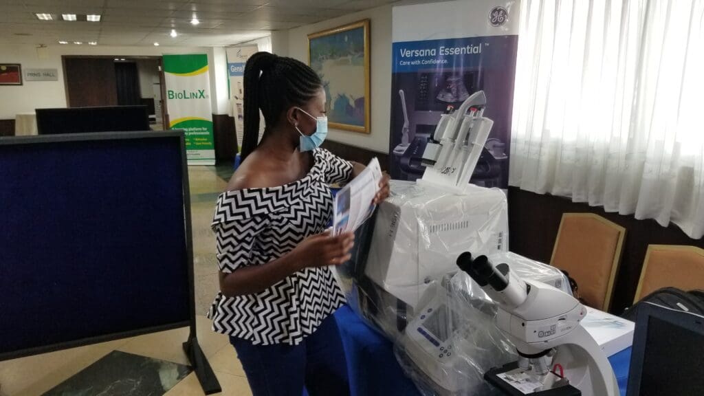 Elise Kafui Ayi  woman biomedical engineer with equipment