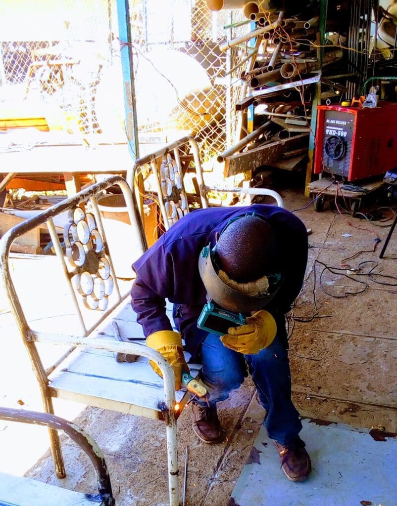 Dennis Mwirigi repurposing hospital beds to chairs