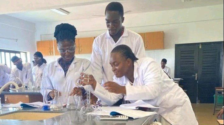 Einstein Adum Ngusra in lab at University of Ghana with other students