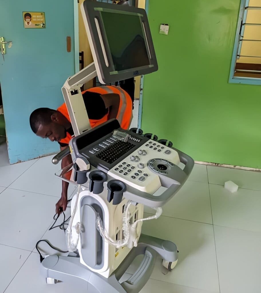 George Nyirenda  Biomedical Engineer fixing scanner
