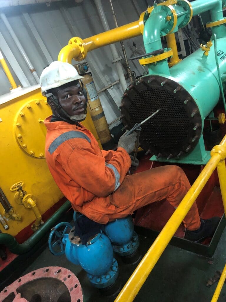 Harrison Amewuda, Marine Engineer, Ghana working on equipment on board