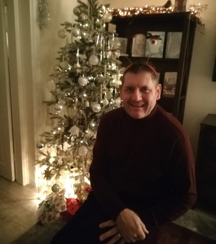 Lee Walters, author of life on the road for field engineers,  fleet manager by Christmas tree at the beginning of 2024