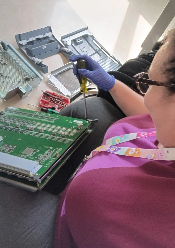 Nicole Ruffin Biomedical Equipment Technician repairing circuit board