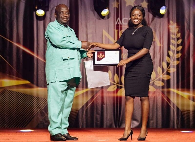 Victoria Mends receiving the award for Most Outstanding Engineering Student in academics, extra-curricula activities and societal impact at Academic City University College's third NSAA awards from the Dean of Engineering's office, Prof. Benjamin Nyarko.